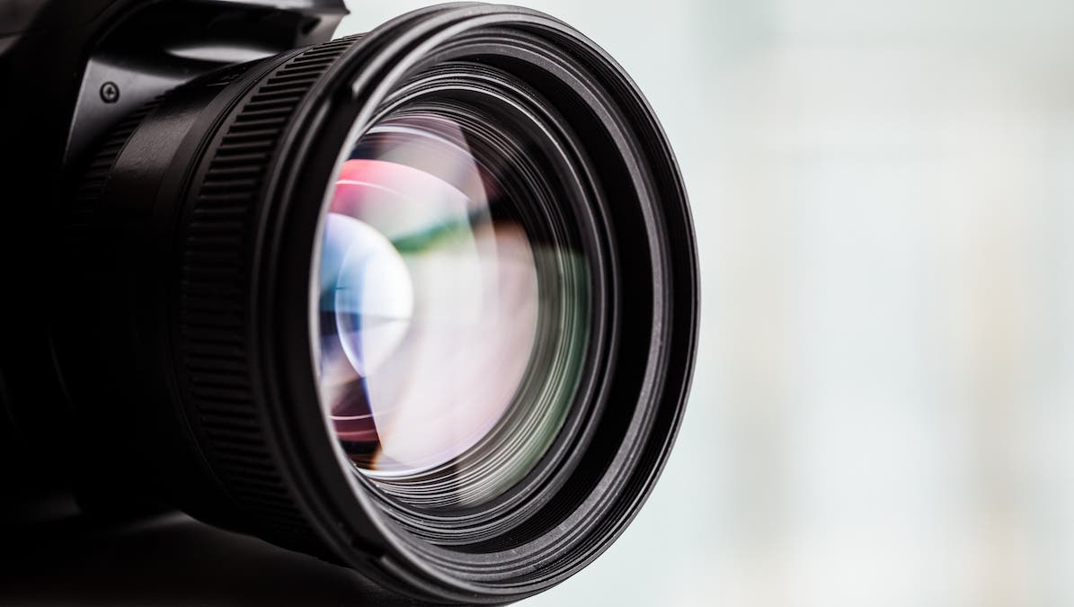 Close-up of a digital camera. Large copyspace
