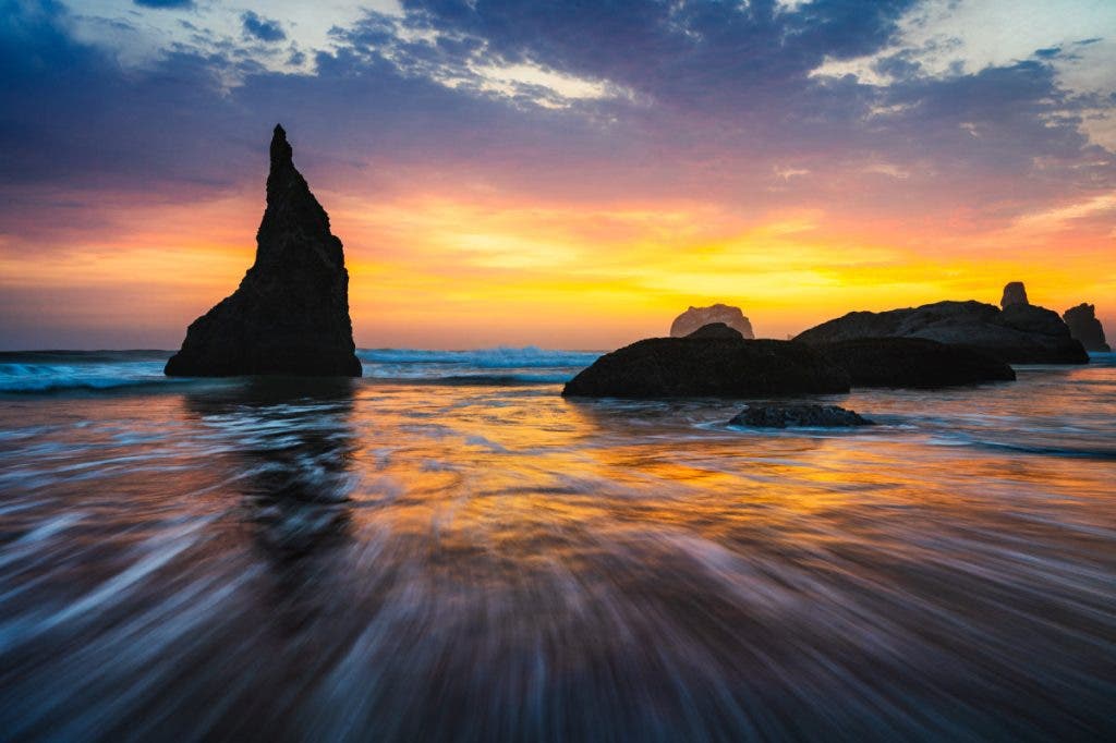 The image on the left has too much contrast. Even though the sunset pops, it appears over-edited. Too much contrast is one of the signs you're over-editing your photos.