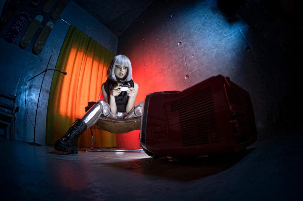 When deciding How to choose the best camera for portraits there are many factors to consider such as ISO. This portrait of a female playing a video game was shot at ISO 400