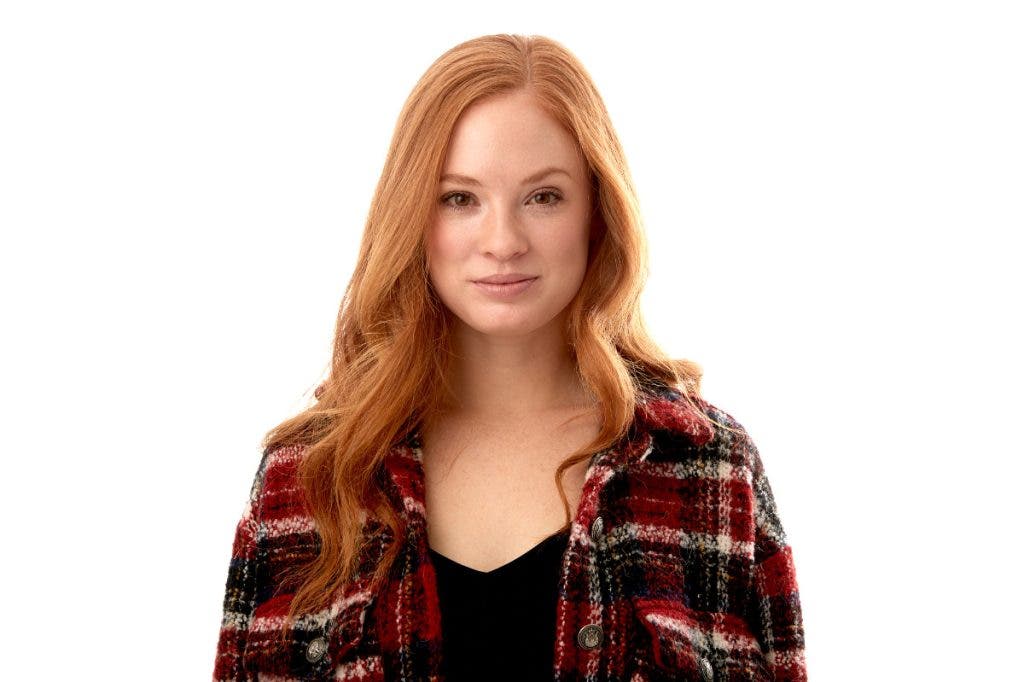 Daniel often uses scrims in his photography for shots like this portrait of a red headed female on a white background