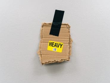 "heavy" object held to a wall with gaffer tape