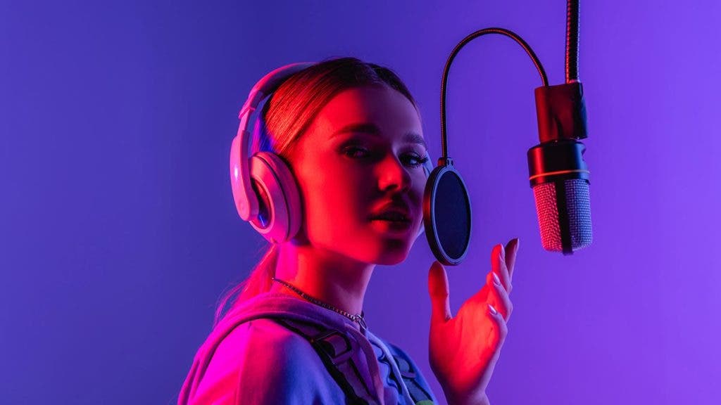 singer using microphone in singing recording studio