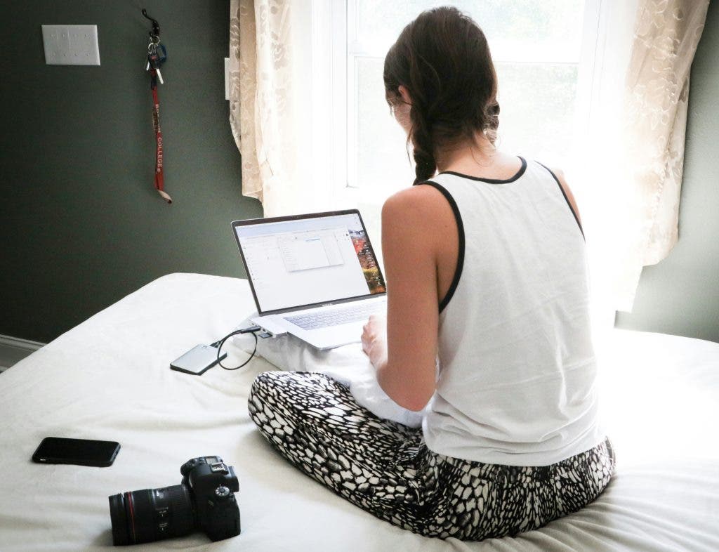 a girl on the bed with her NAS device