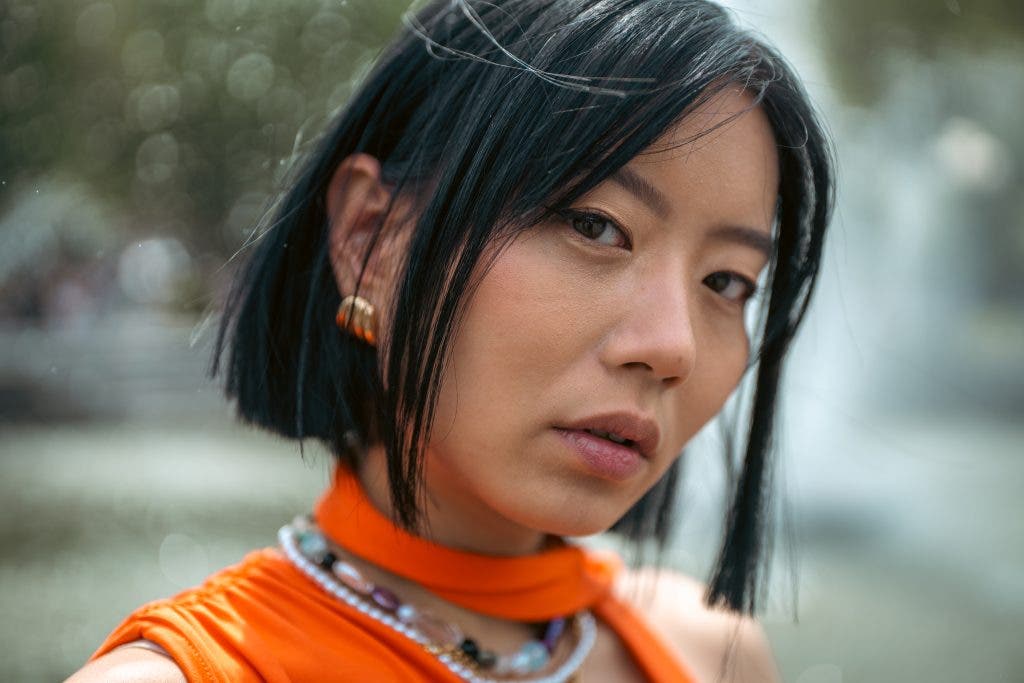 model looking into camera with blurry background