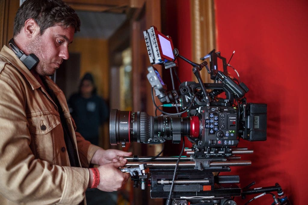 Canon EOS C400 Cinema Camera beside filmmaker