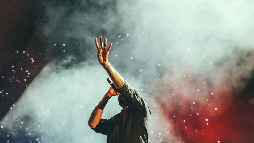 man with wireless microphone on stage