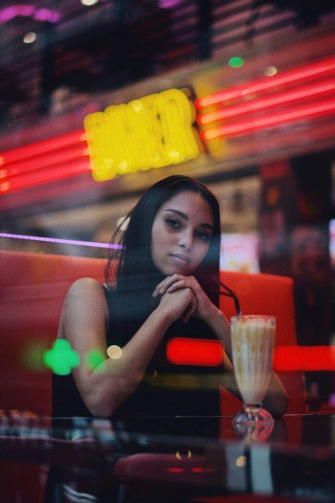 ambient lighting in the diner gives this photo depth