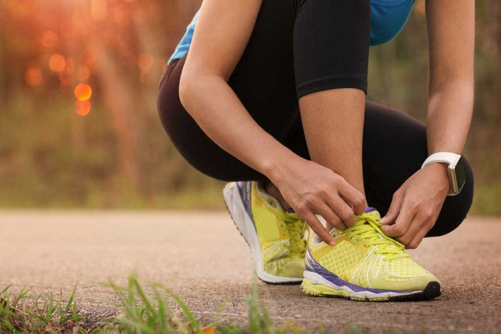 Female runner with Apple Watch