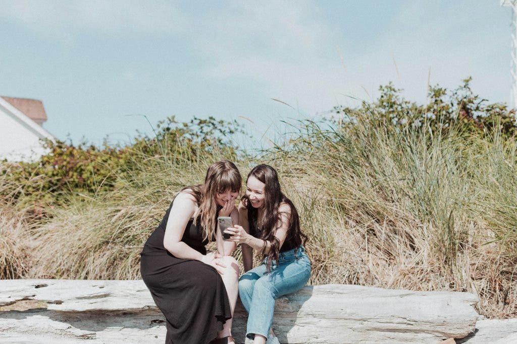 Girls on summer trip answer a Facetime call