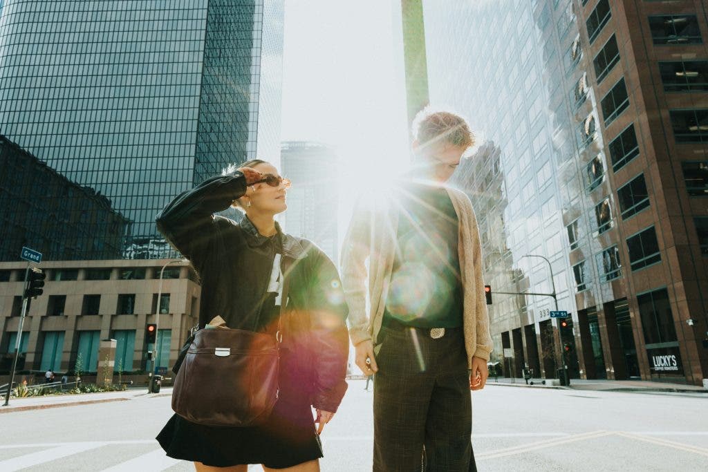 A couple posing for a photo in the city