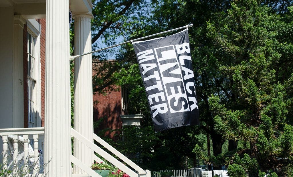 Journalism photography shows Black Lives Matter flag