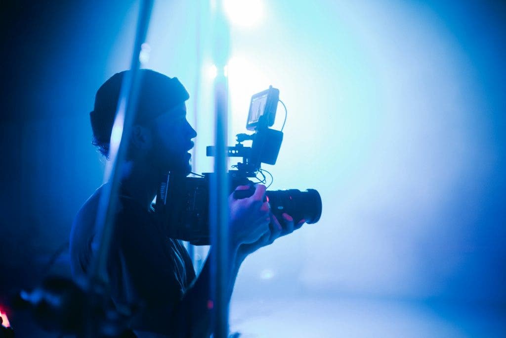 filmmaker in a blue set