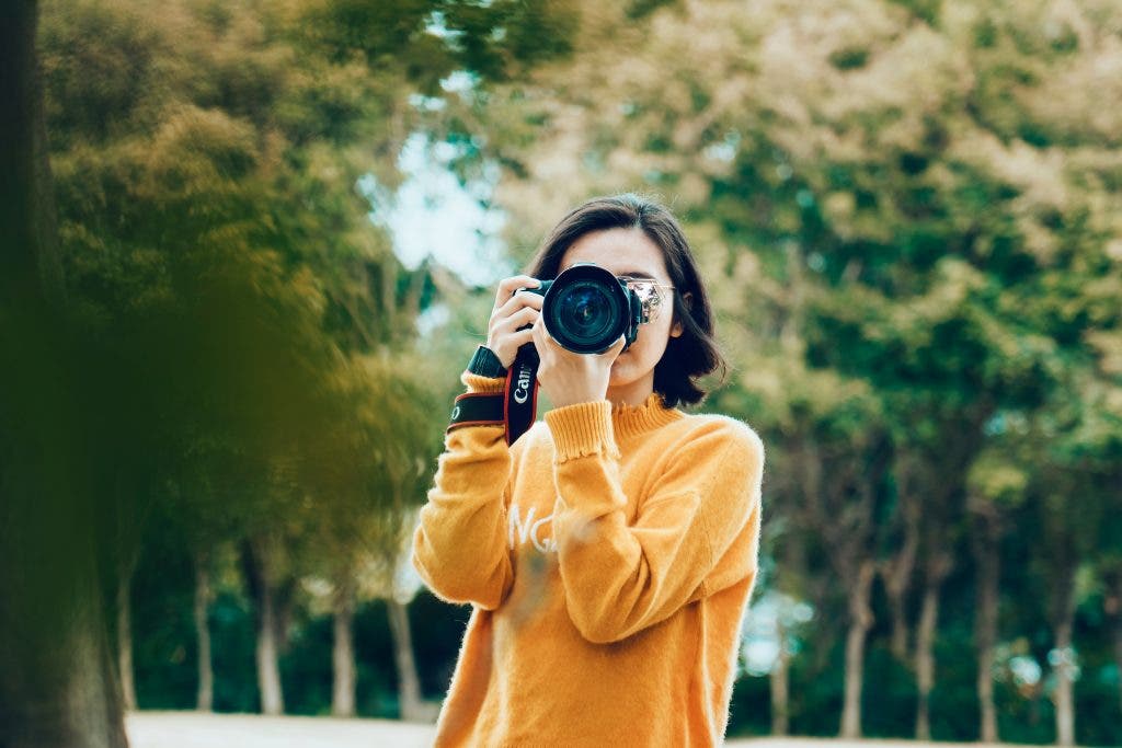 girl holding a camera