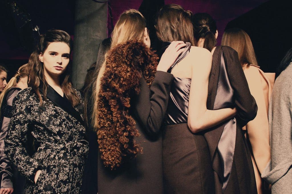 woman getting ready to go on the runway