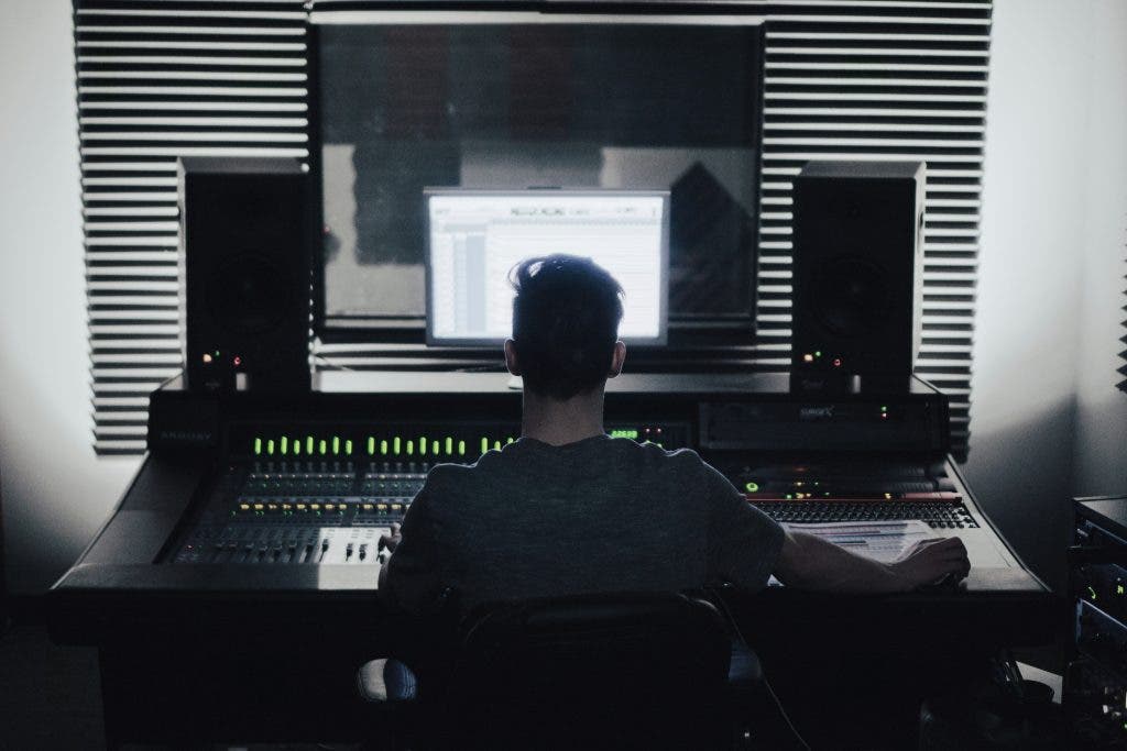 a man in front of his audio studio