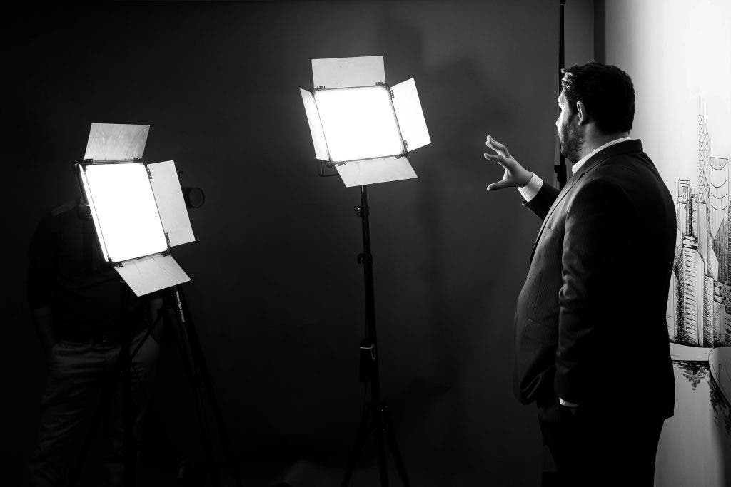 man beside video lights