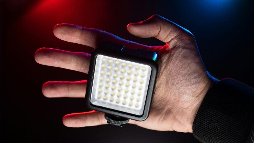 small video light on the palm of a videographer