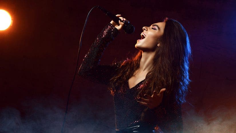a singer using a Sennheiser condenser microphone