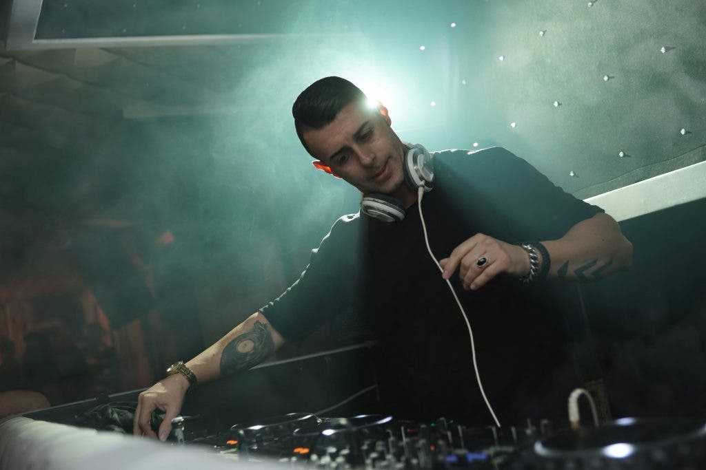 a man using a DJ system