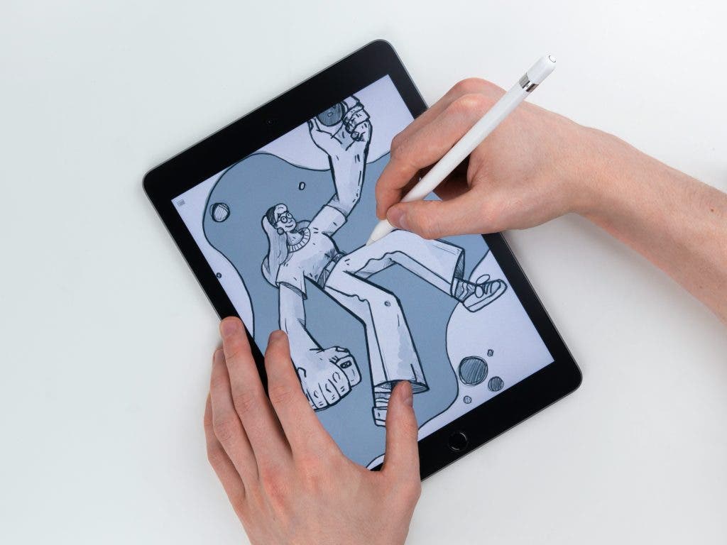 a photo of a sibling illustrator using an iPad