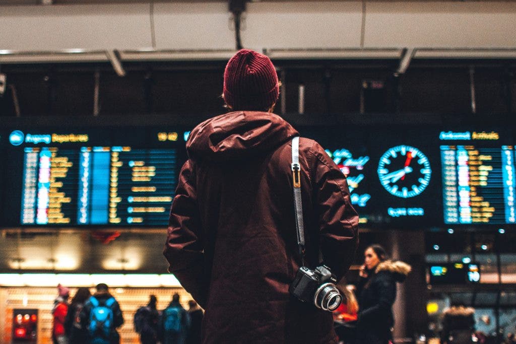 a photographer stands in the airport