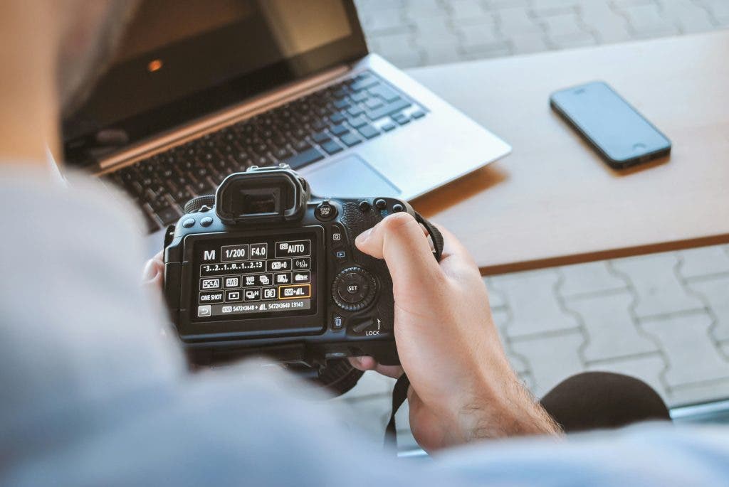 photographer uploads photos to his computer