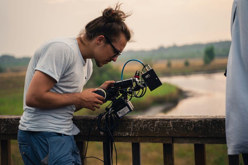 a man holding the best gear for camera assistants