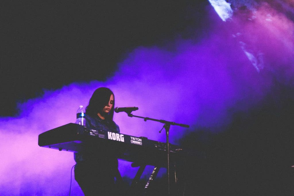 a girl playing the keyboard