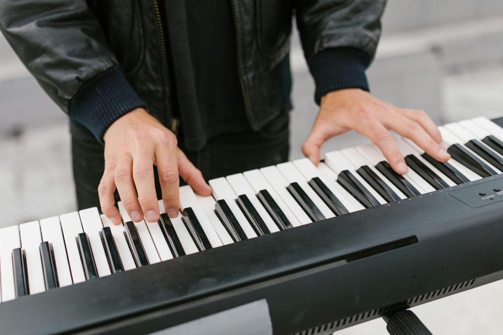 a guy learning the benefits of learning the keyboard