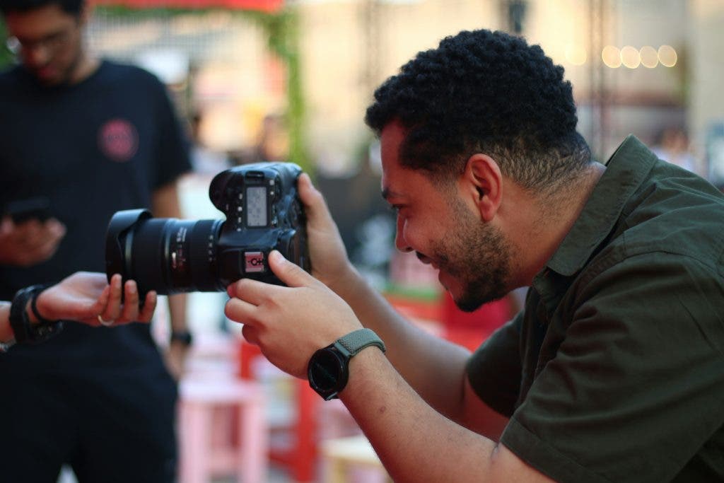 a happy photographer takes photos