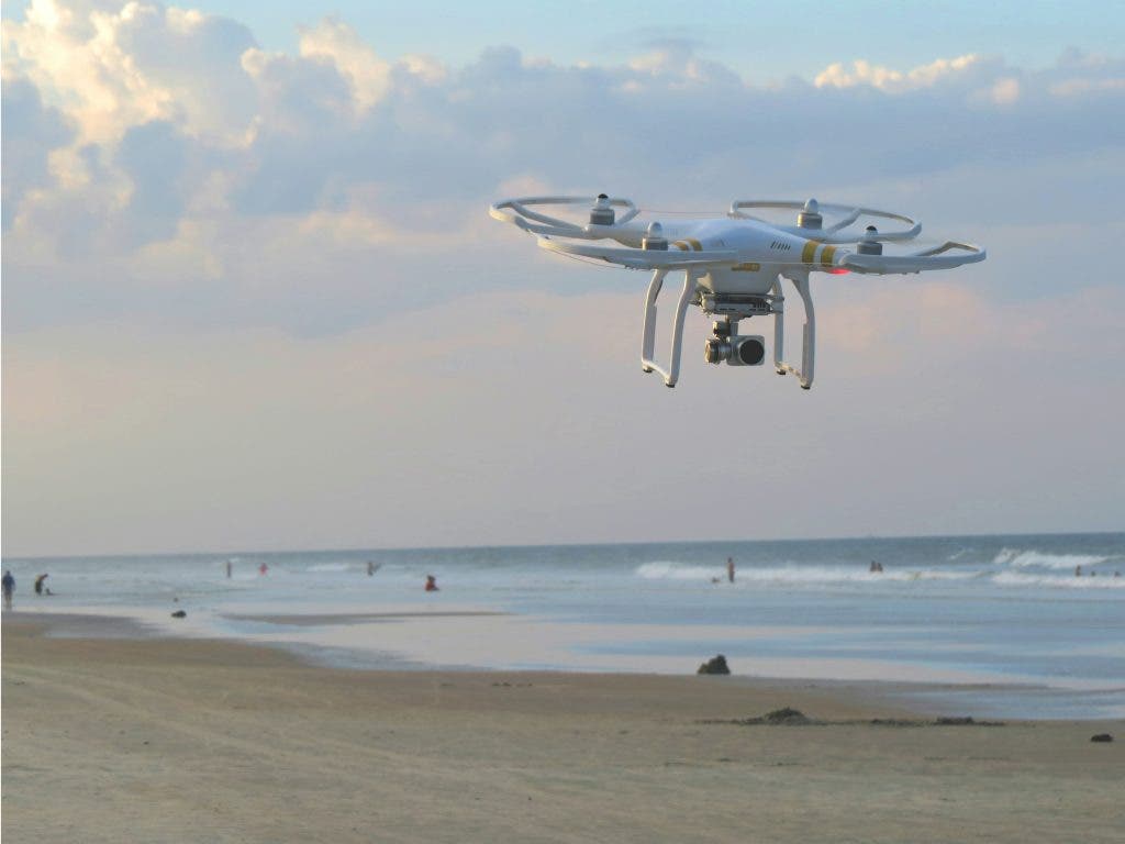 a photo of a surveying drone at the beach