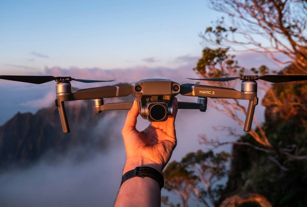 a photo of a drone being held by a surveyor