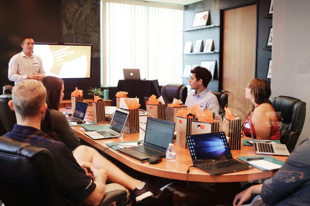 a photo of digital marketers discussing content writing strategies