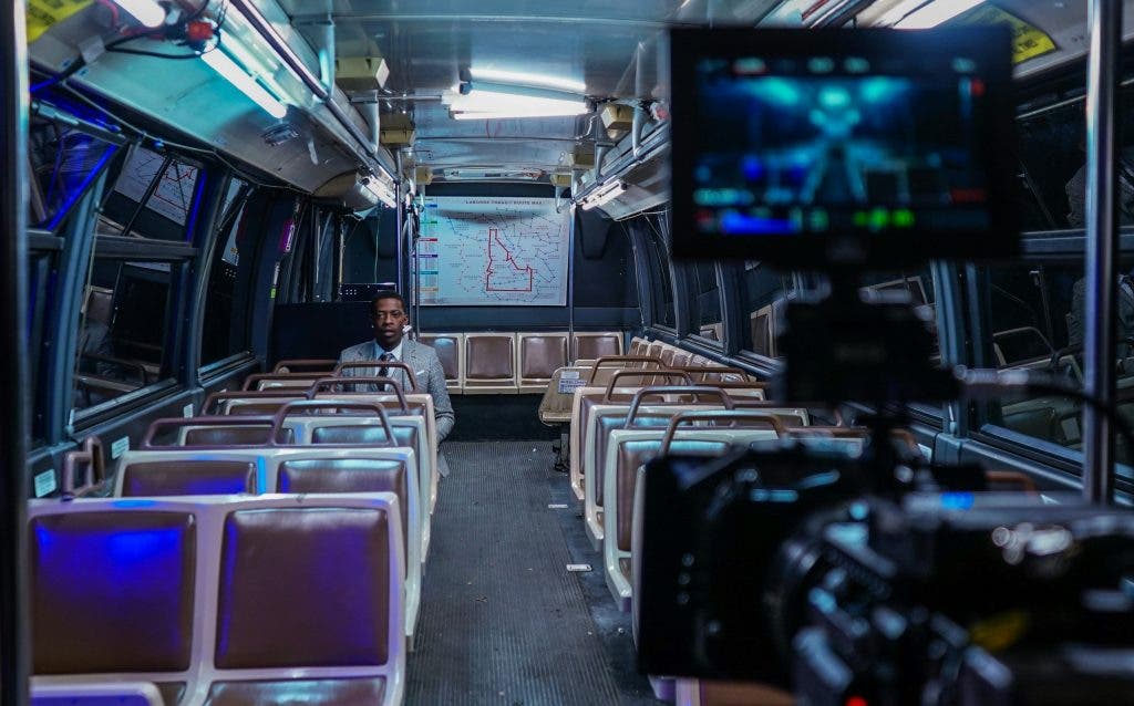 a filmmaking niche behind the scenes of a movie being shot on an empty bus