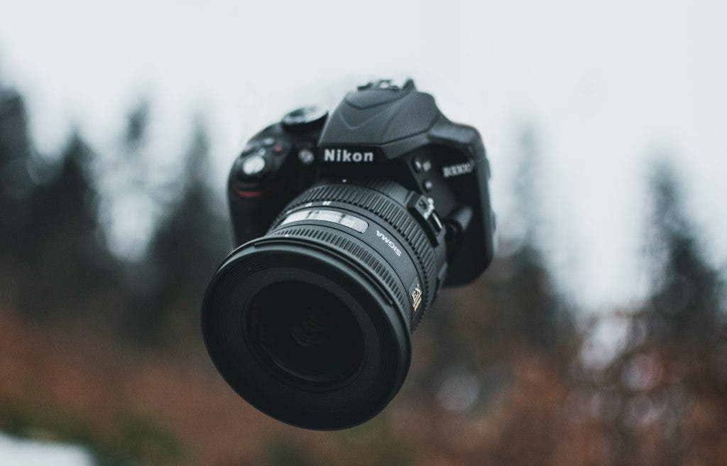 a camera floating up in the air during the winter