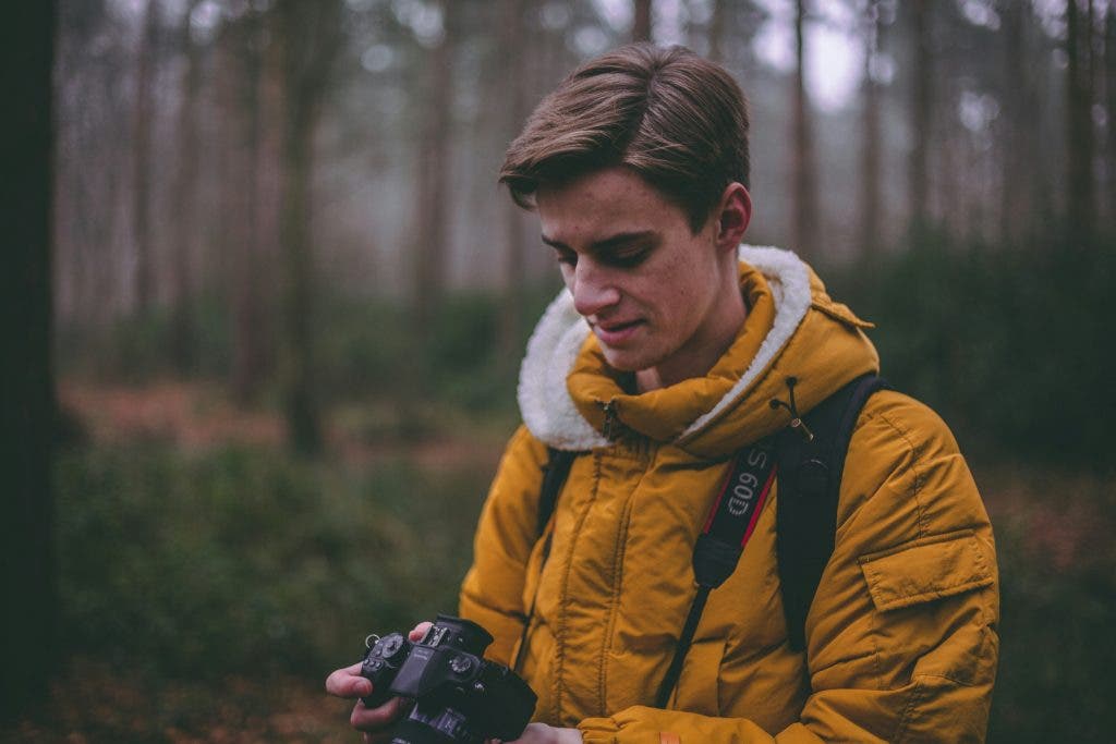 a photographer thinking about camera protection in cold weather for winter photography