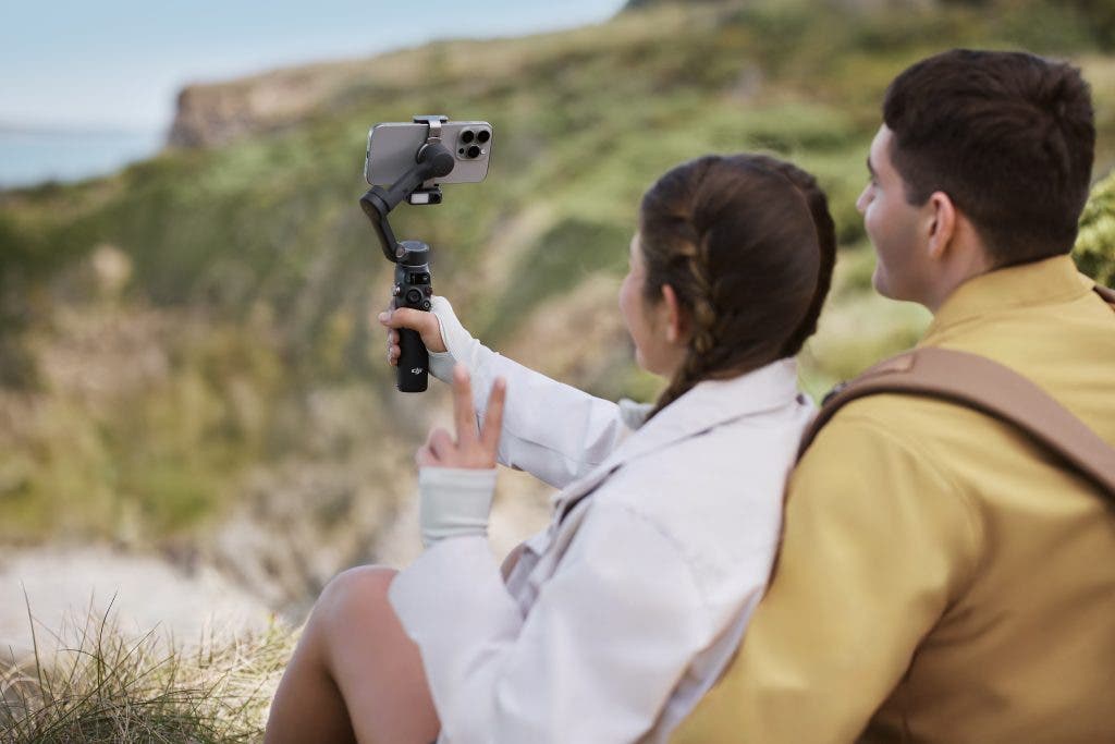Two people doing a DJI Osmo mobile 7 review