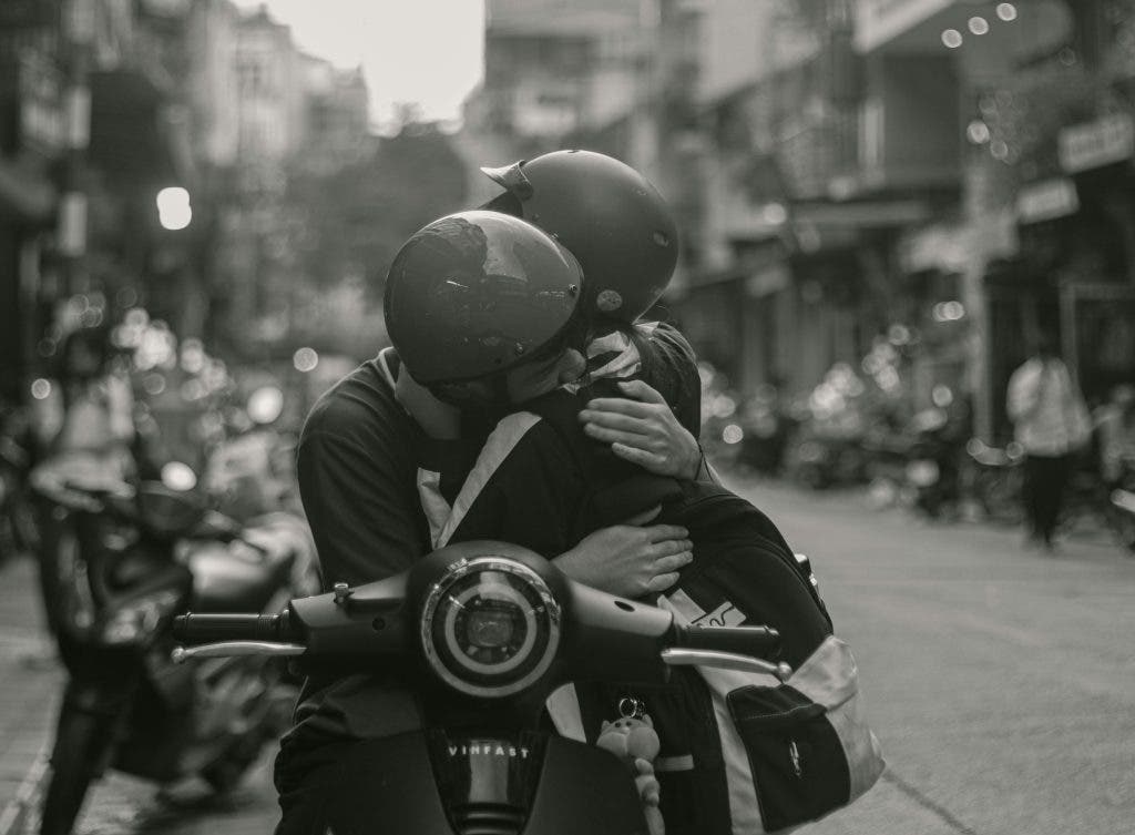 two lovers in the street hugging