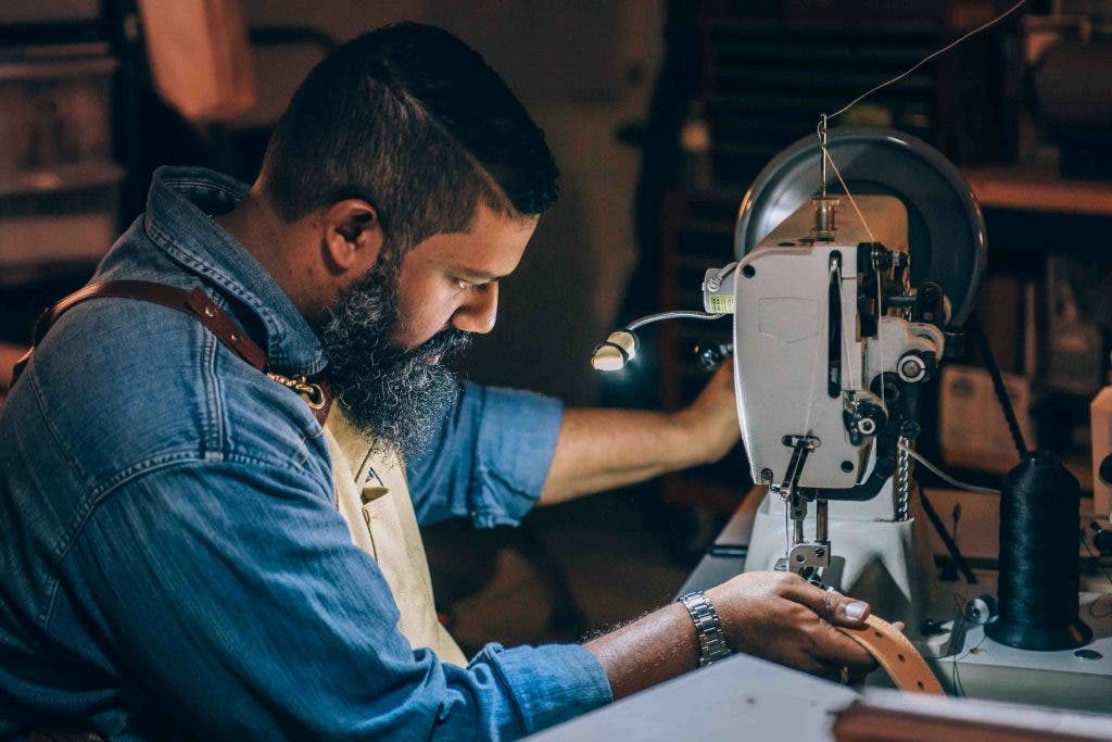 a documentary style photography technique taken of a tailor