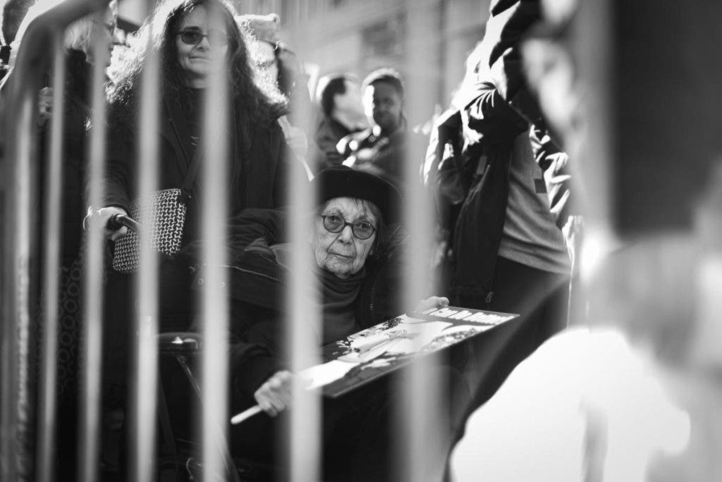 Jen Mullowney Reflects on Her Women's March photos woman behind a barrier