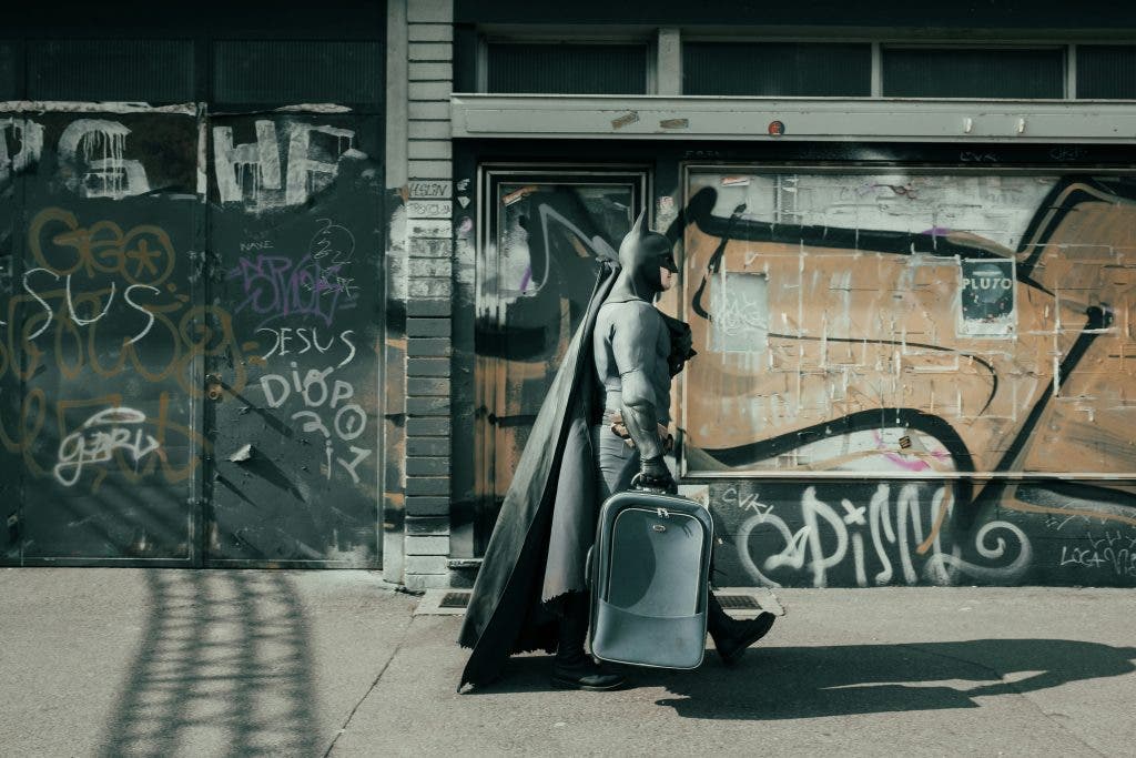 a Batman cosplayer on the way to a cosplay convention