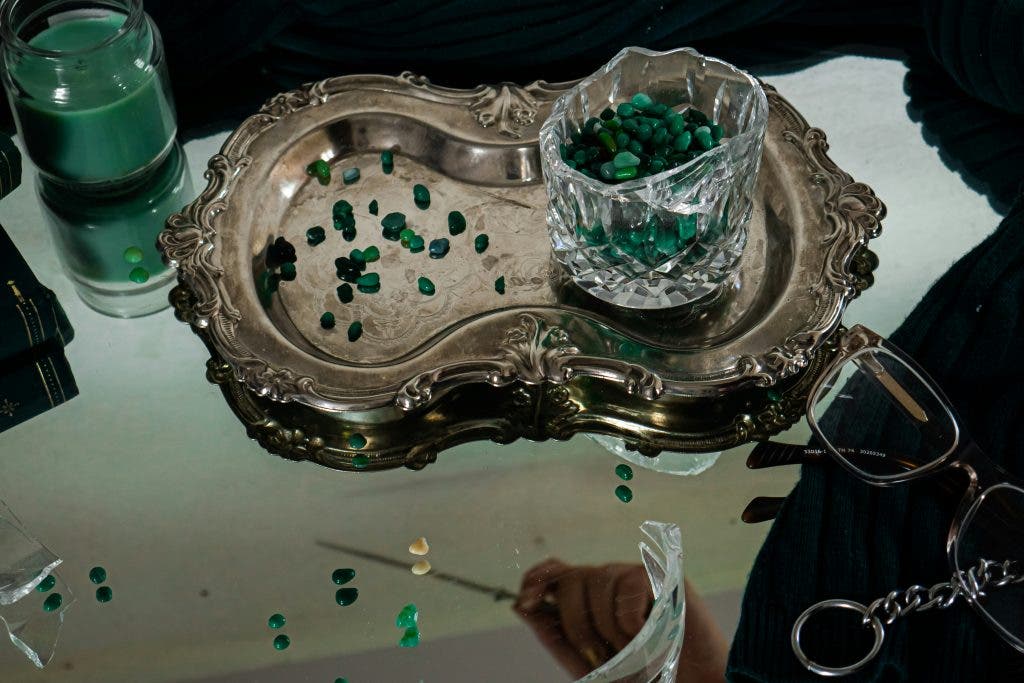 a rusting jewelry tray on a coffee table