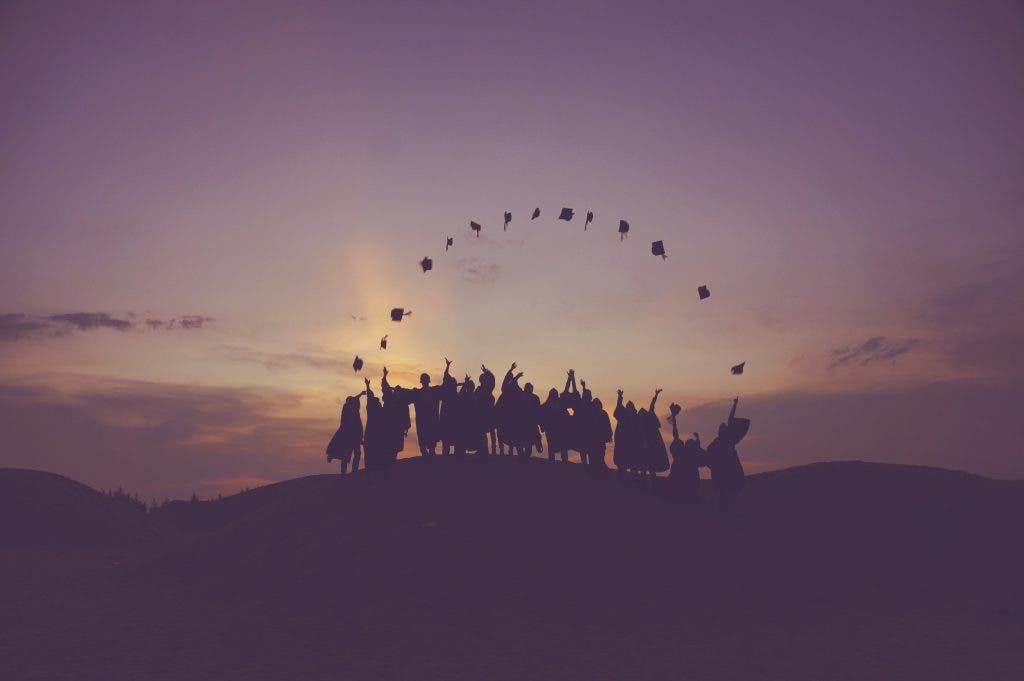 a cap toss against a sunset