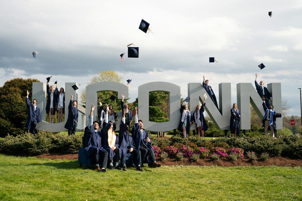 graduates posing for a photo