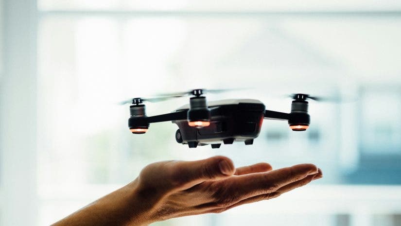 a drone flying over the user's hand