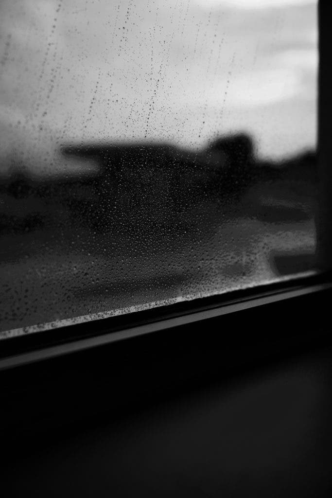 Shot through a diner window after a downpour. The rain made the city blurry, but the emotion stayed sharp.