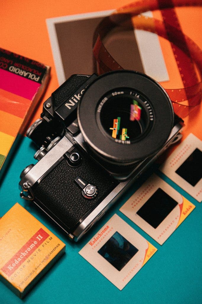 Classic Nikon film photography camera displayed with Kodachrome slide film - the image must have been inspired by Paul Simon