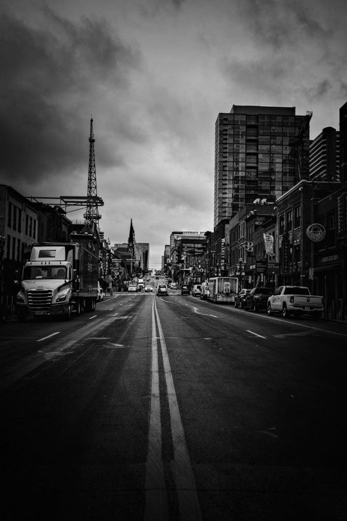 Lower Broadway in the early morning—a place that’s loud by night but strangely reverent when the streets are empty.