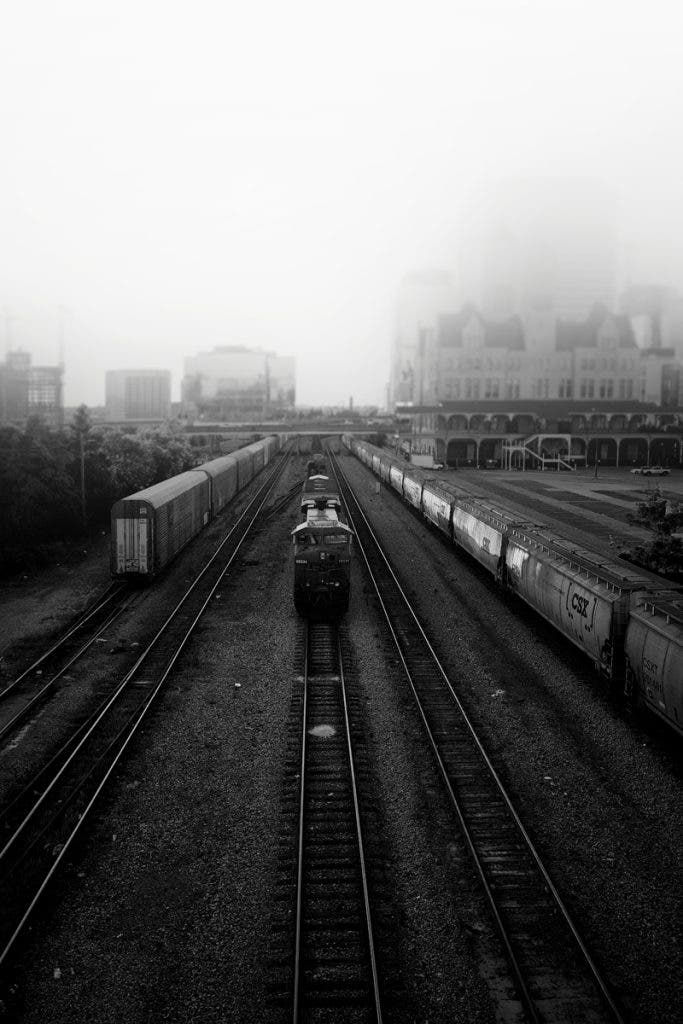 Shot from a bridge on a foggy morning—this image feels like Nashville holding its breath before the city wakes up.