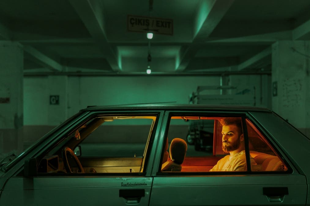 cinematic shot of a person driving a car